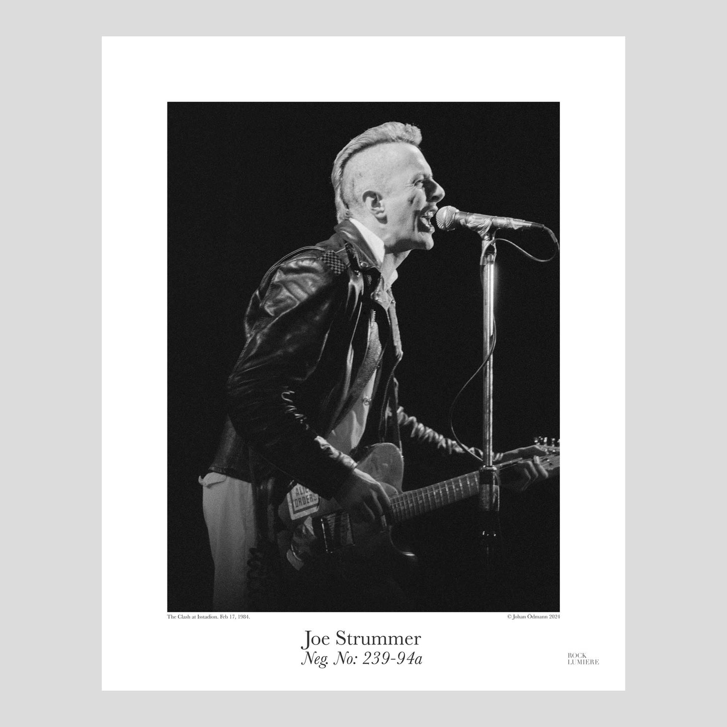 Joe Strummer onstage with The Clash at Isstadion, Sweden, Feb 17, 1984. Photograph by Johan Ödmann. Rock Lumiere Editions offer beautiful Rock Photography Posters and Limited Edition Fine Art Prints. Choose among unique b/w photographs of legendary artists and bands. Rock, Classic Rock, Swedish Garage Rock, Heavy Metal, NWOBHM, Goth, Pop, Blues, Paisley Underground. Order today. Worldwide shipping.
