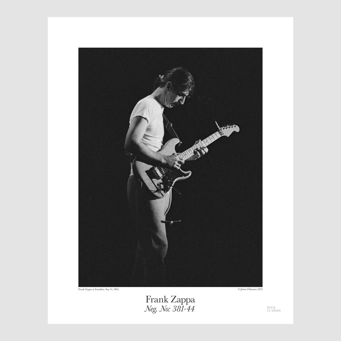 Frank Zappa onstage at Isstadion, Sweden, Sep 14, 1984, shot by Johan Ödmann. Original film negative digital printed using archival pigment ink on archival cotton based paper. Rock Lumiere Editions offer beautiful Rock Photography Posters and Limited Edition Fine Art Prints in different sizes. Order your favorite music photography today. Worldwide shipping.