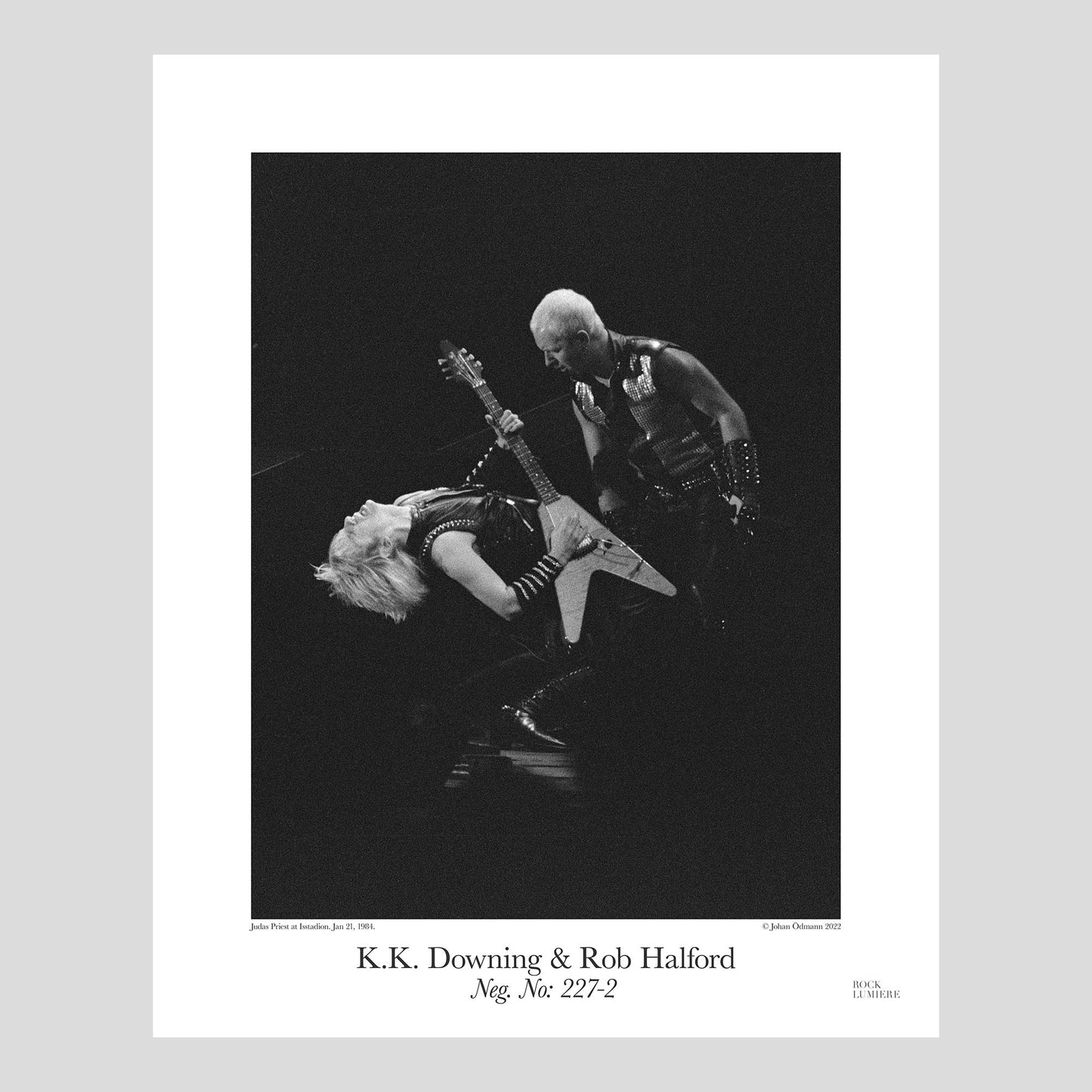 K. K. Downing & Rob Halford on stage with Judas Priest at Isstadion, Sweden, Jan 21, 1984. Photography by Johan Ödmann. Rock Lumiere Editions offer beautiful Rock Photography Posters and Limited Edition Fine Art Prints.  Choose among unique b/w photographs of legendary artists and bands.  Rock, Classic Rock, Swedish Garage Rock, Heavy Metal, NWOBHM, Goth, Pop, Blues, Paisley Underground. Order today. Worldwide shipping.