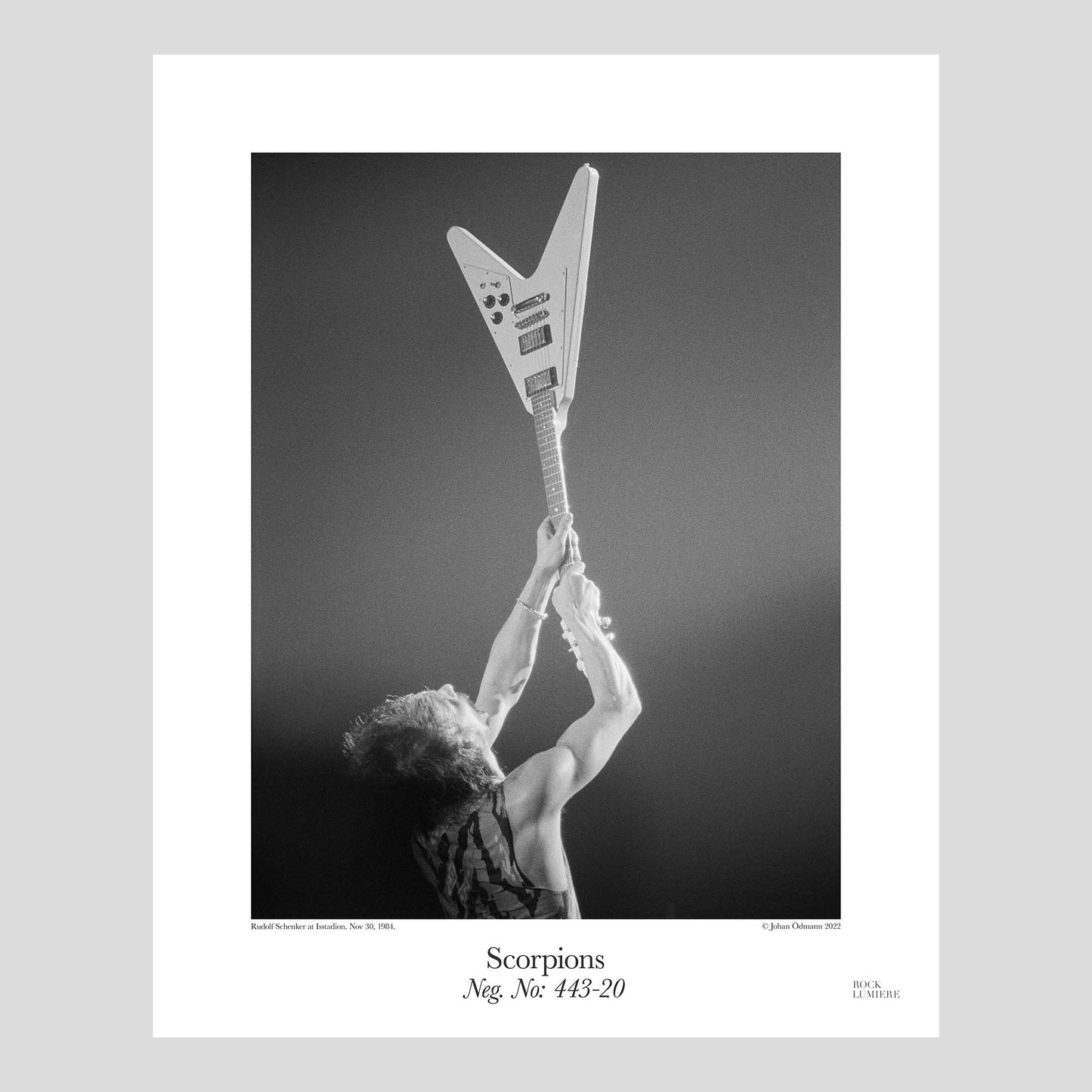Rudolf Schenker with his white Flying V on stage with Scorpions at Isstadion, Sweden, Nov 30, 1984. Photograph by Johan Ödmann. Rock Lumiere Editions offer beautiful Rock Photography Posters and Limited Edition Fine Art Prints. Choose among unique b/w photographs of legendary artists and bands. Rock, Classic Rock, Swedish Garage Rock, Heavy Metal, NWOBHM, Goth, Pop, Blues, Paisley Underground. Order today. Worldwide shipping.