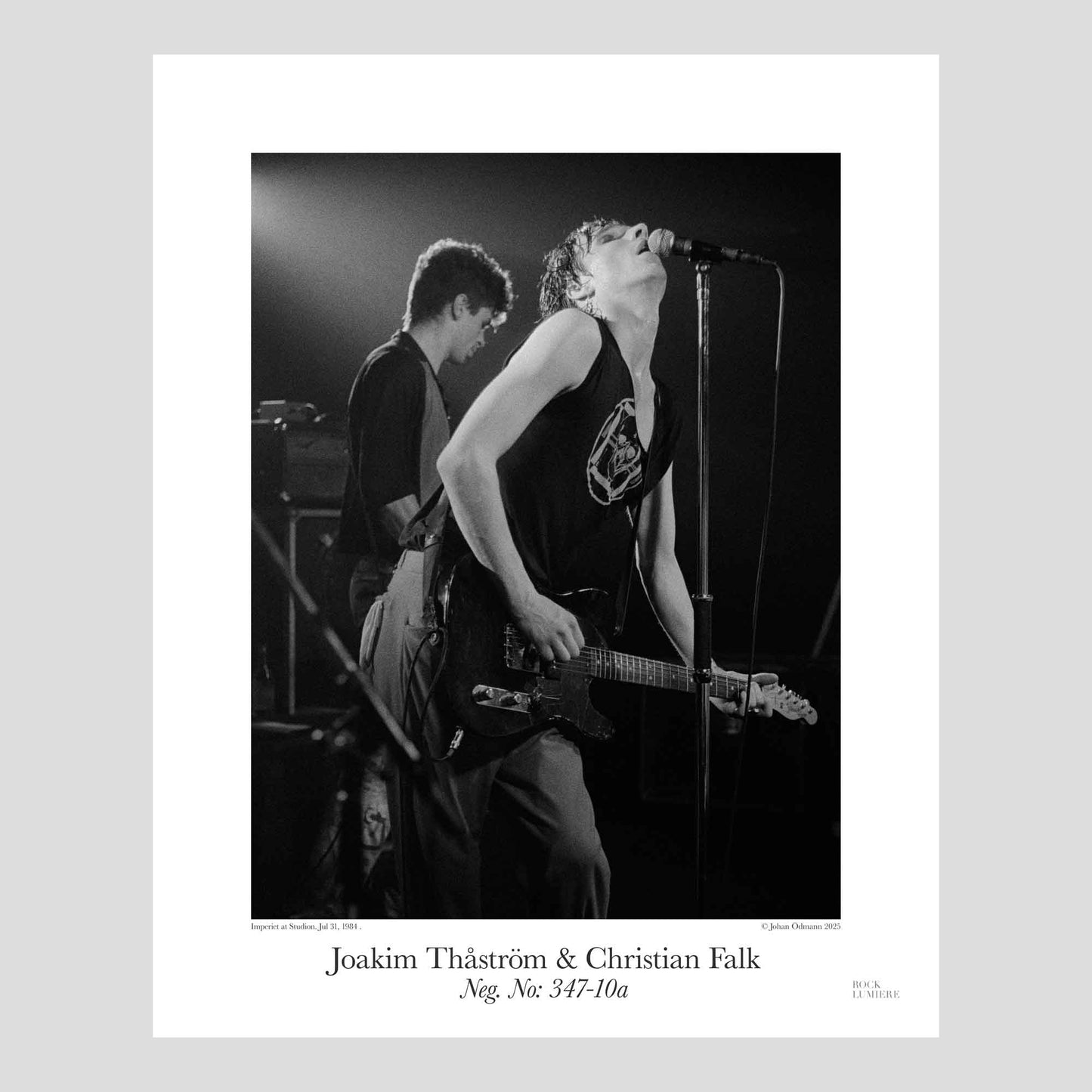 Joakim Thåström and Christian Falk on stage with Imperiet at Studion, Stockholm, Jul 31, 1984. Photography by Johan Ödmann. Rock Lumiere Editions offer beautiful Rock Photography Posters and Limited Edition Fine Art Prints.  Choose among unique b/w photographs of legendary artists and bands.  Rock, Classic Rock, Swedish Garage Rock, Heavy Metal, NWOBHM, Goth, Pop, Blues, Paisley Underground. Order today. Worldwide shipping.