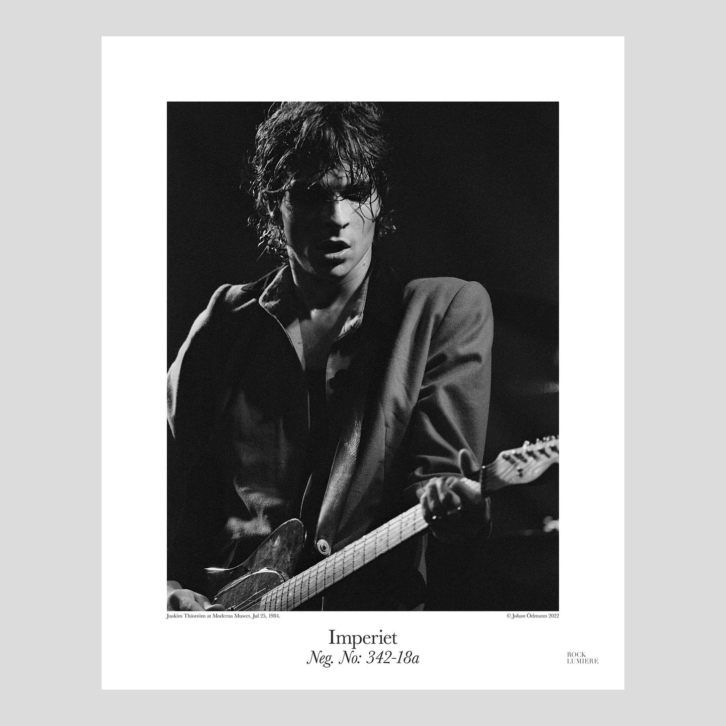 Joakim Thåström on stage with Imperiet at Moderna Museets Trädgård, Jul 25, 1984. Photograph by Johan Ödmann. Rock Lumiere Editions offer beautiful Rock Photography Posters and Limited Edition Fine Art Prints.  Choose among unique b/w photographs of legendary artists and bands.  Rock, Classic Rock, Swedish Garage Rock, Heavy Metal, NWOBHM, Goth, Pop, Blues, Paisley Underground. Order today. Worldwide shipping.